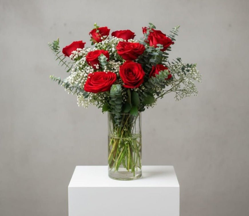 Red rose with white baby breath in vases