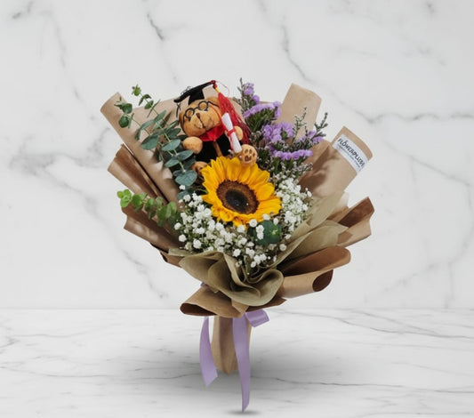 Sunny Meadows with graduation bear